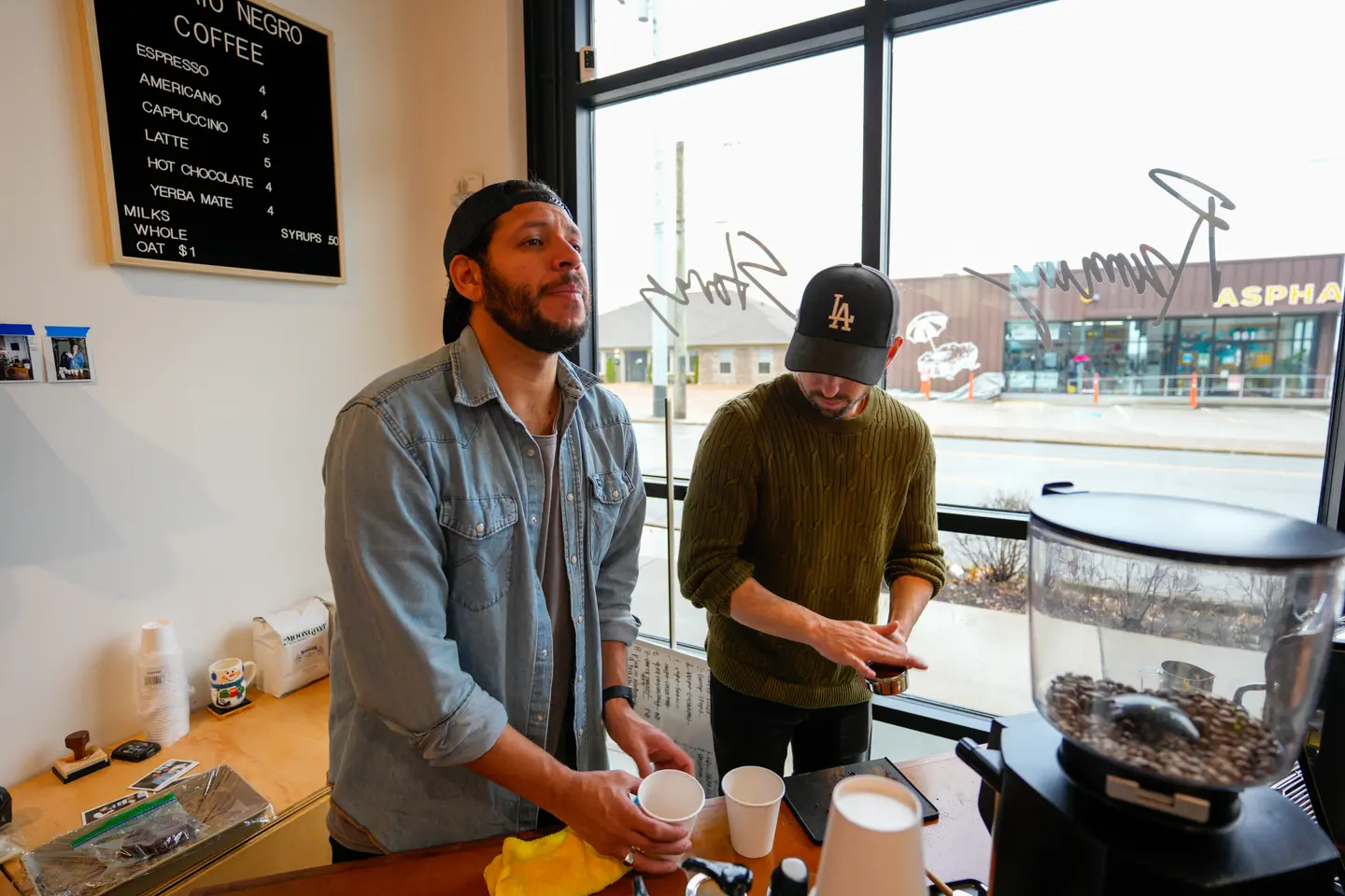 Phil and Juan making coffee at an event