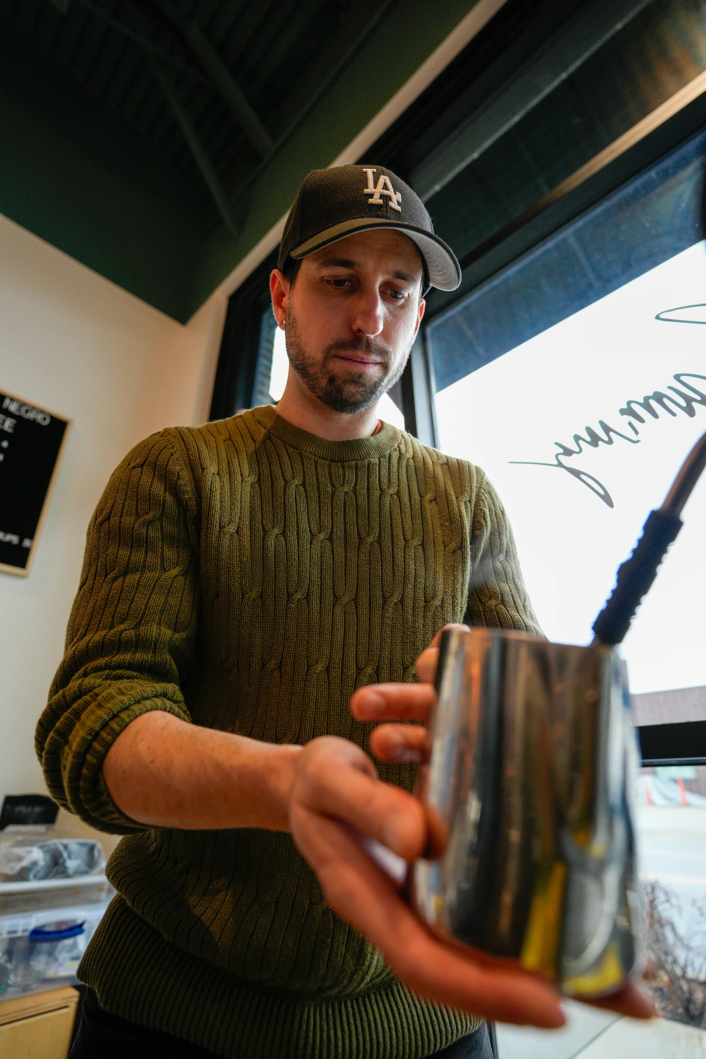Portrait of Phil Bartko working the El Gato Negro cart at The Exchange residency