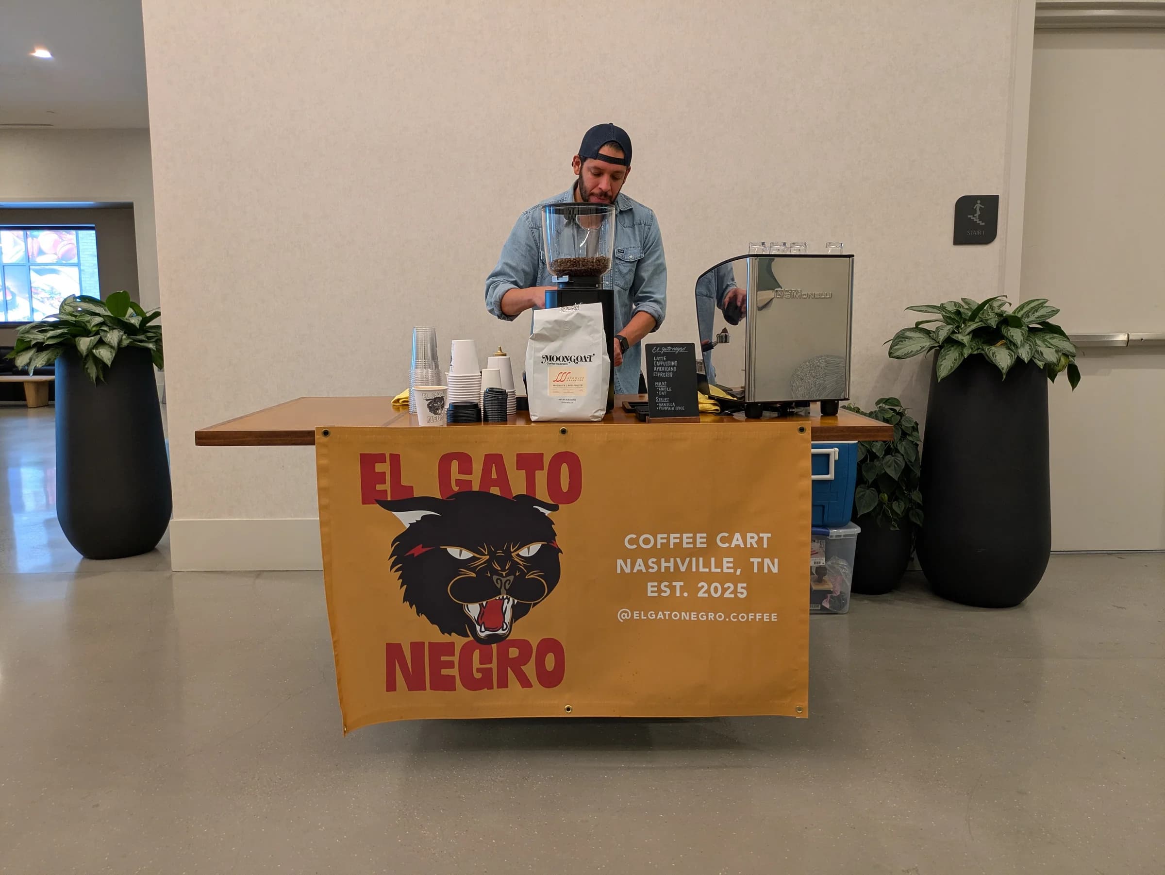 Juan pulling shots at the 1111 Church leasing office coffee cart residency