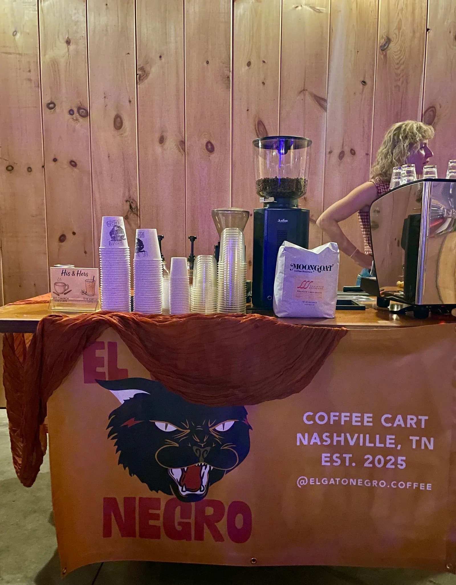 El Gato Negro cart set up with wedding florals, barista ready to serve reception guests